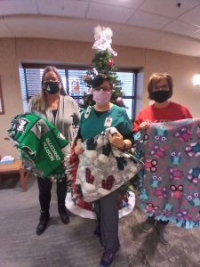 One Stop Student Services and Student Finance make and donate blankets to Cancer Center