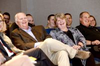 Leon Osborne (center), with his wife, Kathy, and son, John, enjoy a laugh during a tribute event for the Chester Fritz Distinguished Professor of Atmospheric Sciences at UND. More than 100 people attended the event for Osborne to celebrate his career and accomplishments. Photo by Jackie Lorentz.