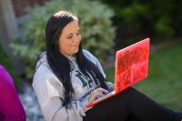 A UND business student enjoys the great outdoors while keeping up with her classes through the school's robust online and distance learning programs. Photo courtesy of the UND College of Business & Public Administration.