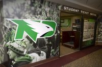 A new Fighting Hawks logo is emblazoned across UND Student Ticket Office in the Memorial Union. Photo by Shawna Schill.