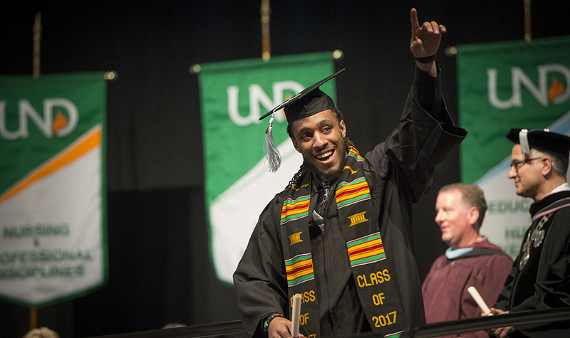 Tajreed Rich, a Minneapolis native, celebrates his degree from UND at the school's general commencement ceremony on Saturday, May 13, at the Alerus Center. Photo by Jackie Lorentz.