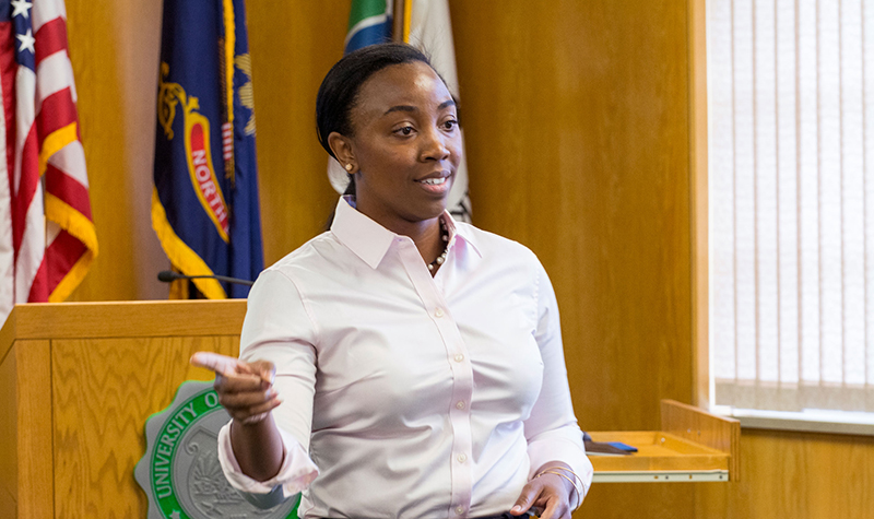 Angelique Foster, associate executive assistant to the UND president, kicks off an initial meeting of goal captains and project managers for implementation of the new One UND strategic plan  on June 20. Photo by Richard Larson.