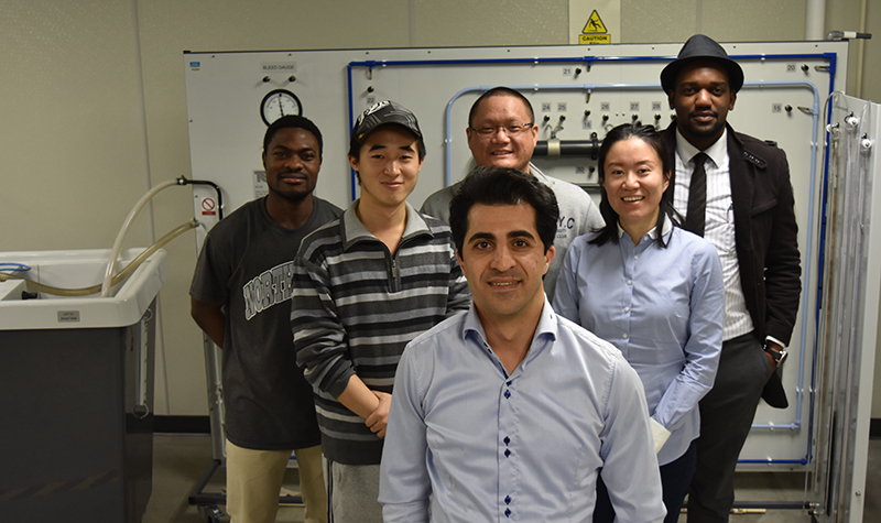 A research team in the UND Department of Petroleum Engineering, led by Hadi Jabbari (front center) is digging deep into this challenging resource and developing ways to get more oil out—part of a host of strategies collectively called Enhanced Oil Recovery, or EOR. Image courtesy of Juan Pedraza.