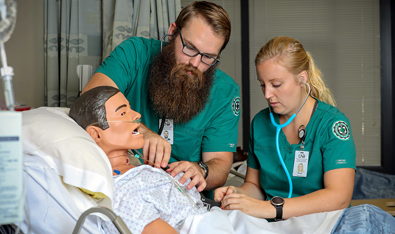 Brittany Egeland and Ethan Plemel both passed on the first try and will be employed by Mayo in the cardiovascular surgery and heart transplant ICU. Photo by Jackie Lorentz/UND Today.