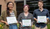Holding their framed certification as Main Street GF Challengers, Anisa Holwerda, Maura Ferguson and Carter Razink have been working all summer on their community-bettering ideas. Photo by Connor Murphy/UND Today.
