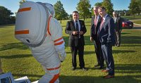 At the NASA-funded Inflatable Mars/Lunar Habitat, Bridenstine (center) and Sen. Kevin Cramer (right) are greeted by a student wearing a space suit designed by Pablo DeLeon (left), head of the UND Human Spaceflight Laboratory. Photo by Patrick C. Miller/UND Today.