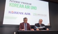 During a joint signing on Monday morning, Byung Il Yoon, vice president of Korean Air's Flight Crew Training Center (left) and Paul Lindseth, dean of the John D. Odegard School of Aerospace Sciences (right) codified a new Pathway program for UND's commercial aviation students. Photo by Connor Murphy/UND Today.
