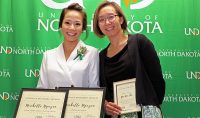 Michelle Yguyen (left) and Yee Han Chu at event recognizing UND's student national scholarship recipients.