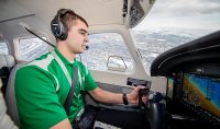 Travis Gylling graduated from UND in four years with two aviation degrees and a job in the airlines already lined up. Photo by Schawna Schill/UND Today.