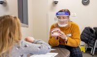Clear masks help clear way for serving patients in the pandemic