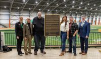 The family of Frederick D. "Fritz" Pollard Jr. was present at UND on Friday, Sept. 17, to unveil a replica plaque that tells the Pollard Jr. story, including his connection to UND. Once completed, a permanent plaque for Pollard Jr. will be set at the former UND High Performance Center, a building that now bears his name. Pictured above are (left to right) DeAnna Carlson Zink, CEO of the UND Alumni Association & Foundation; Bill Chaves, UND Athletics Director; Fritz Pollard III, Meredith; Kenny and UND President Andy Armacost. UND photo.