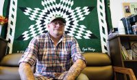 Patrick Schmid’s friends and former colleagues at Spirit Lake Head Start gifted him with a star quilt upon his UND graduation in 2020. It’s adorned with his Dakota name, Oyate Waokiye, which means Helper of the People. Photo by Sam Melquist/UND Alumni Association & Foundation