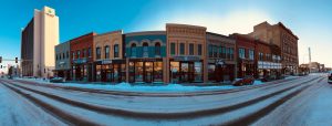 picture of a main street in a rural town with several businesses side by side.