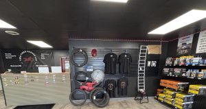 photo inside showing retail items like shirts, tires, and other accessories.
