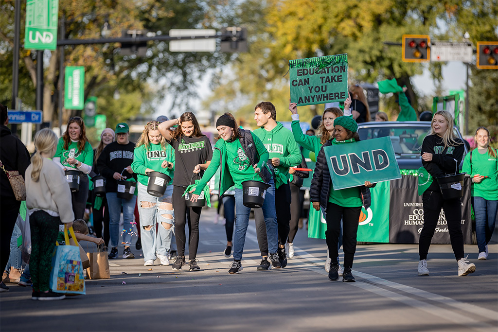 CEHD students and faculty march in an undated UND Homecoming Parade.