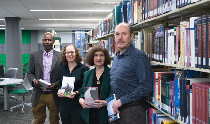 Pictured from left to right: Jared Keengwe, Cynthia Prescott, Helene Weldt-Basson and Forrest Ames are among the faculty who have written books in the last year. Also featured in the story, but not pictured here, is Sean Valentine.
