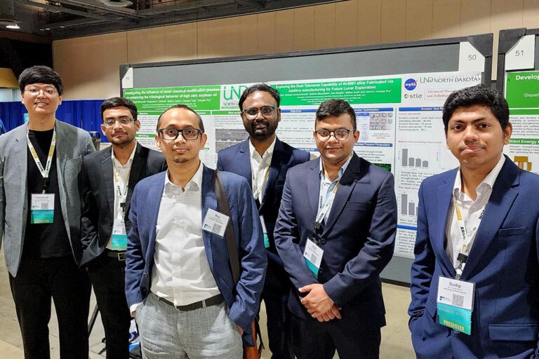 Sougata Roy and his graduate students at STLE's annual meeting