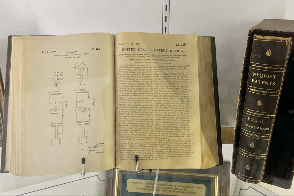 A book displayed within a glass display case
