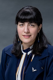 A professional headshot of Moones Alamooti.