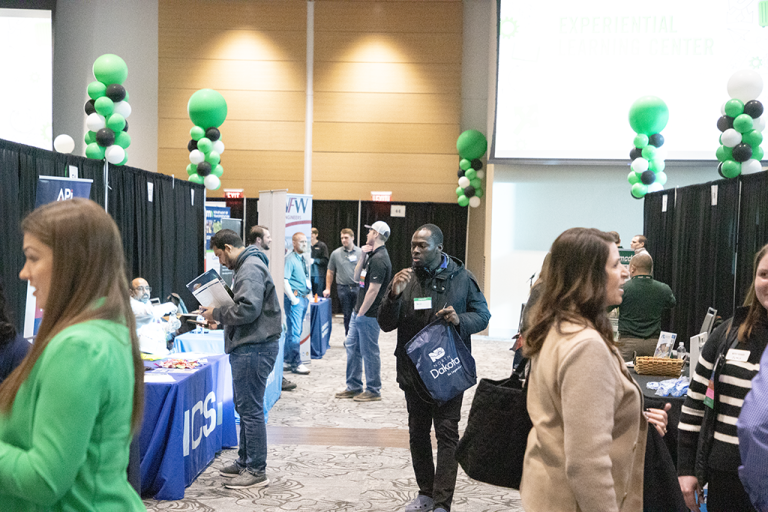 A ballroom full of students and employers at a career fair held at the University of North Dakota's Memorial Union.