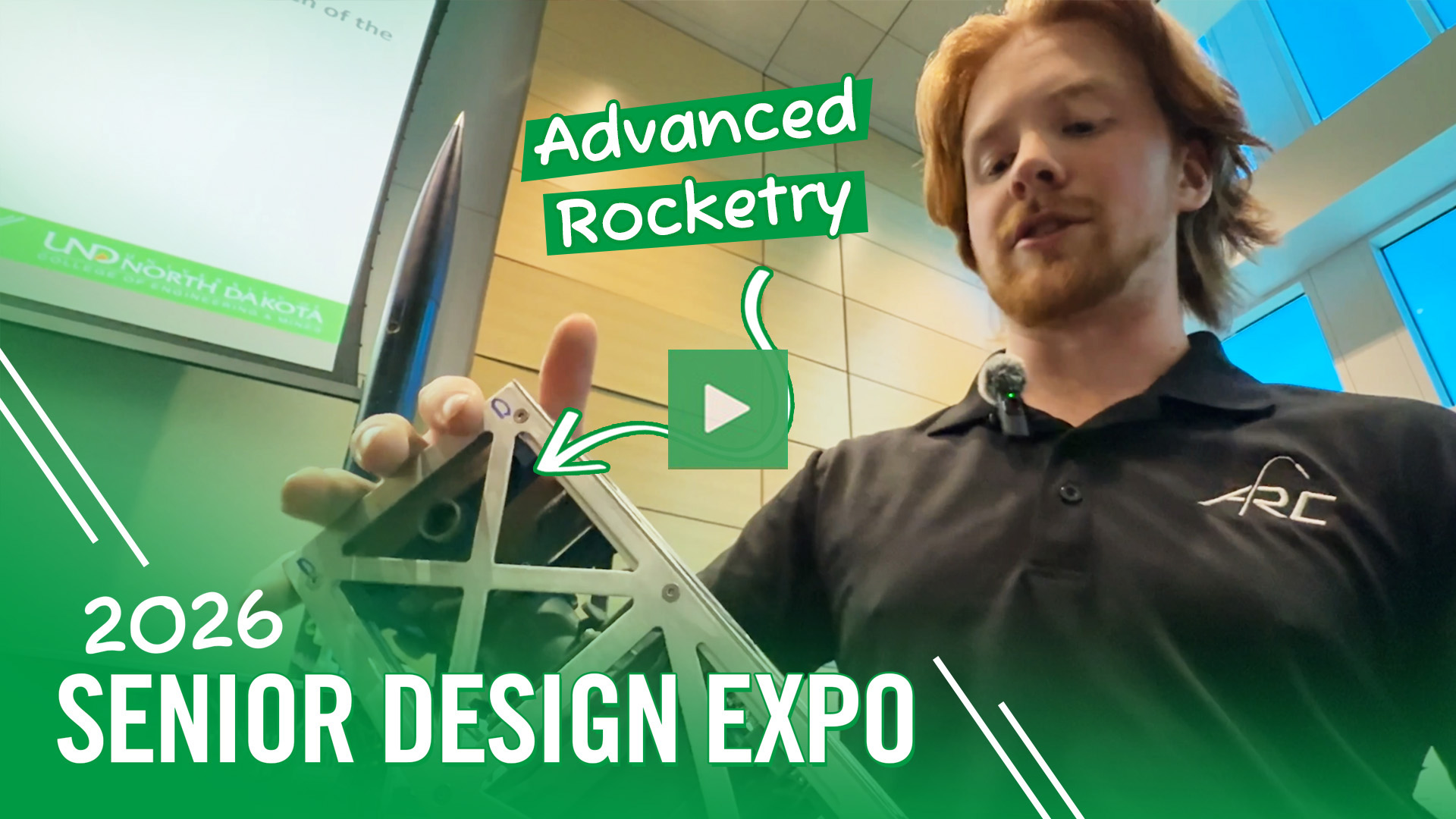 A video thumbnail that reads: "2026 Senior Design Expo | Advanced Rocketry". The thumbnail features a student gesturing to a prototype as he stands next to a research poster.