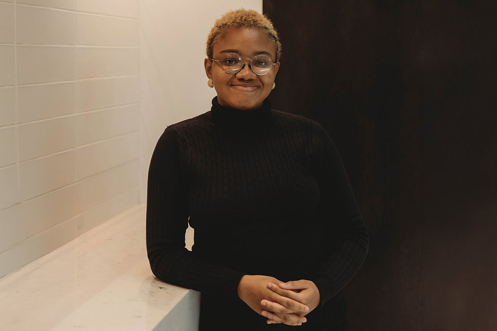A student smiles in a professional photo.