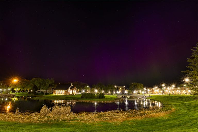 A night sky on the University of North Dakota campus reveals the Northern Lights.