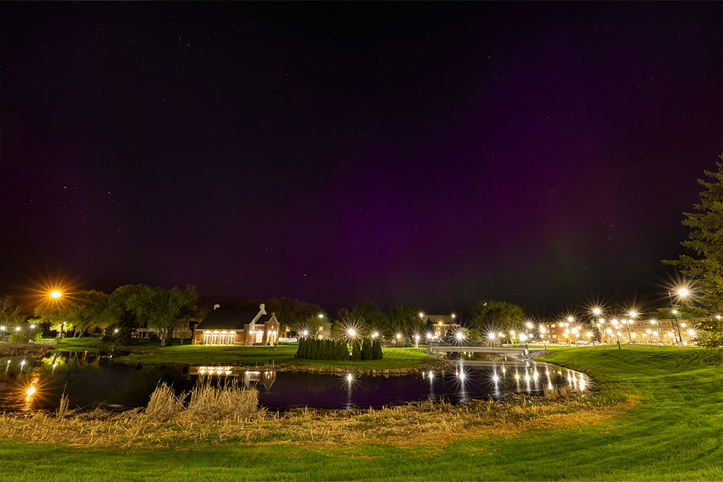 A night sky on the University of North Dakota campus reveals the Northern Lights.