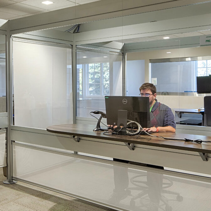 student working at a large desk