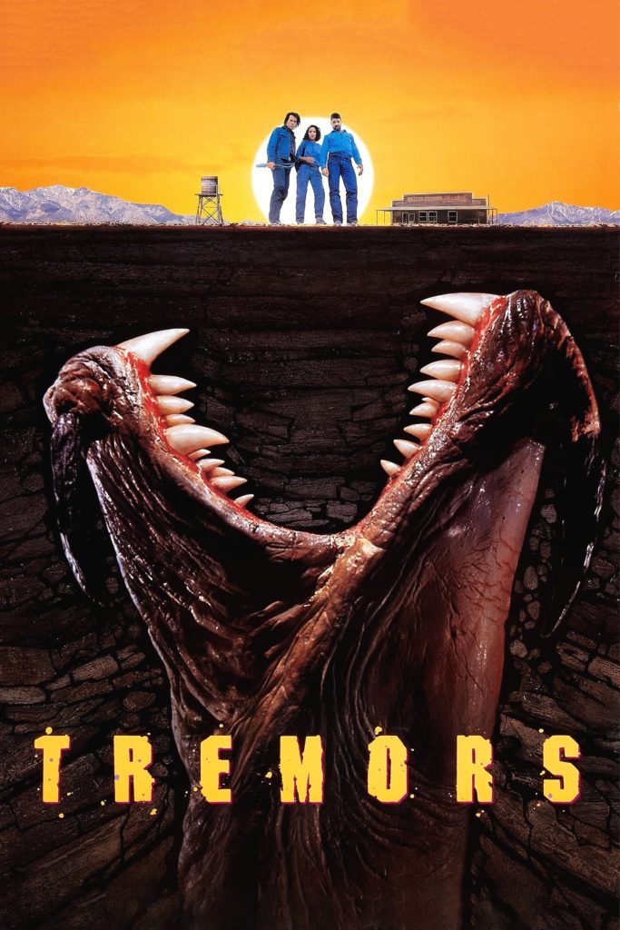 Movie poster for Tremors, showing a giant, toothy mouth rising from the ground towards three small human figures