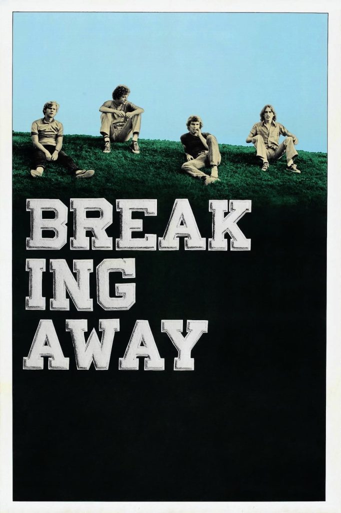 Movie poster for Breaking Away depicting the young men of the film seated together atop a hill