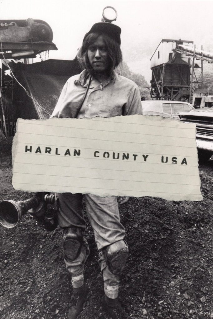 Movie poster for Harlan County, U.S.A. showing a woman standing in a coal field