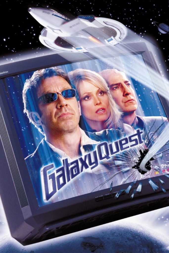 Movie poster the film Galaxy Quest, depicting a starship breaking through a TV display of the central cast