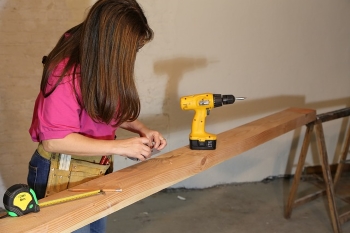 Woman carpenter working on a project