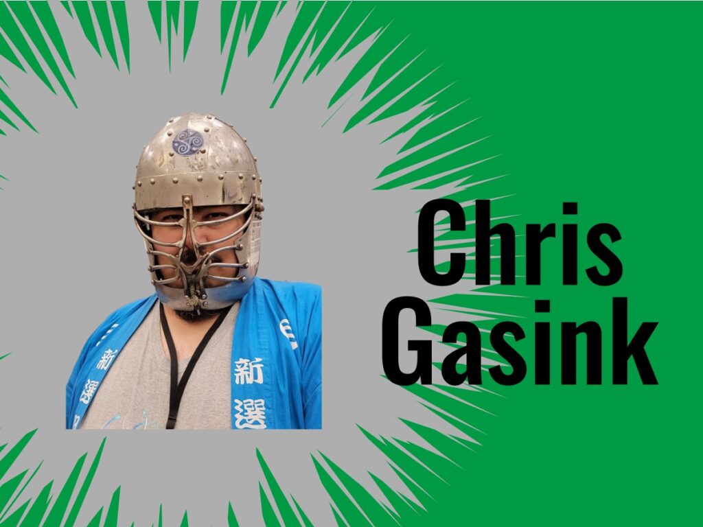 Chris Gasink in a knights helmet and blue Japanese shirt