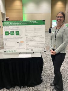 Dr. Brenna Swanson stands with her poster presentation.