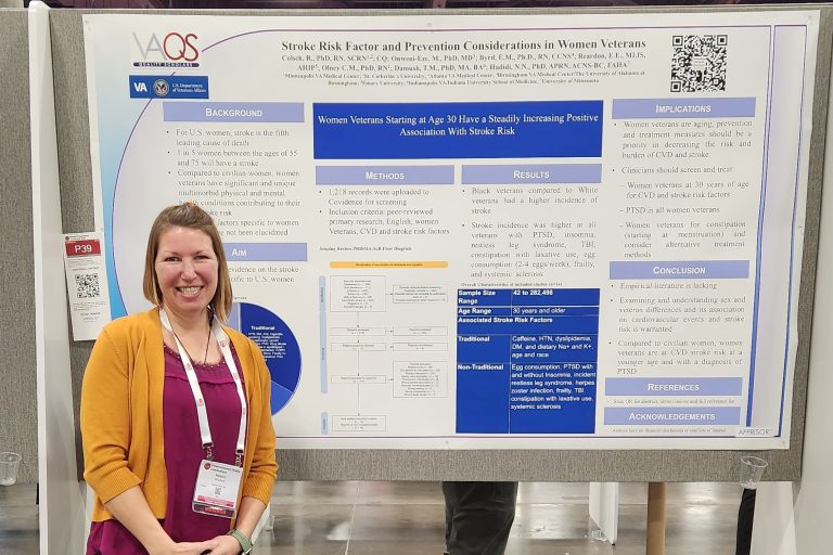 Dr. Renee Colsch standing in front of her research poster