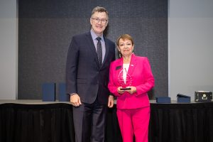 UND president Andy Armacost and Barb Anderson pose with Barb's Award