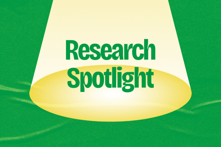 Graphic image showing a spotlight on the words "Research Spotlight"