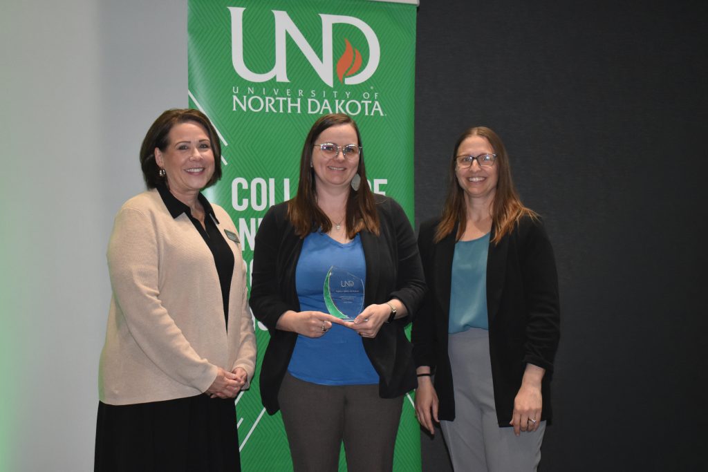 Kaitlyn Kelly Shikanai receives her award