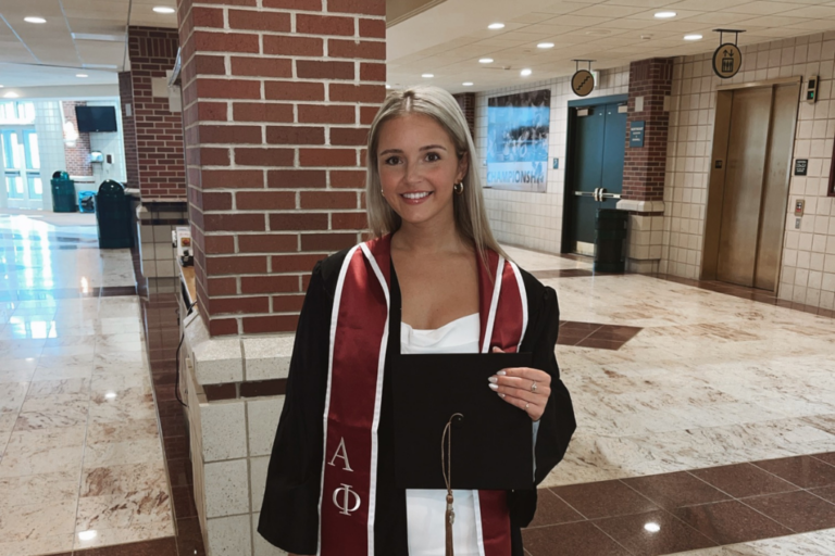 Madi Gilbertson wearing graduation gown