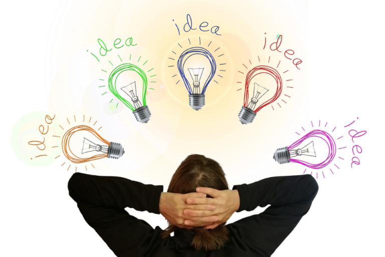 Back view of person leaning back, head resting in hands, hand-drawn lightbulbs floating above