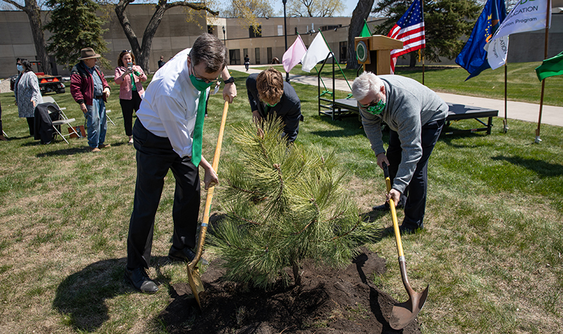 UND officials planting tree