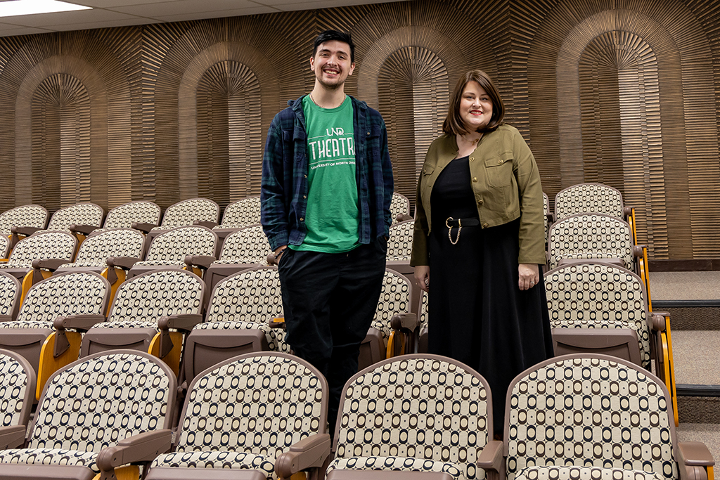Emily Cherry Oliver and Jace Toutenhoofd in a traditional classroom