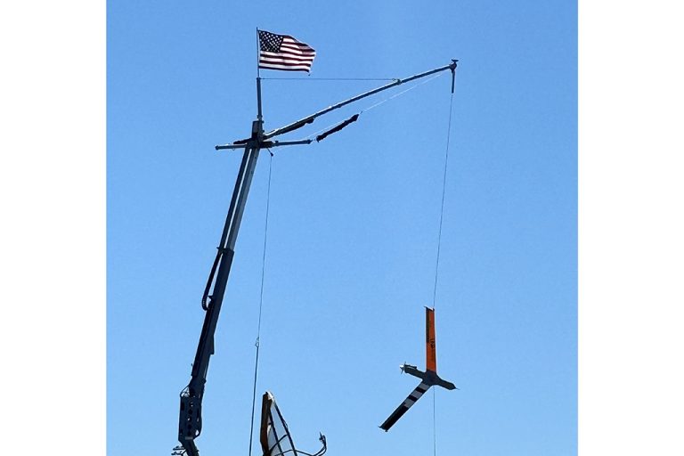 Crane lifting uncrewed aircraft system