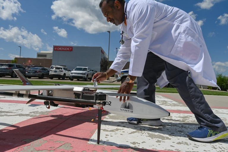 Dr. Ben Kazim retrieves medication from drone