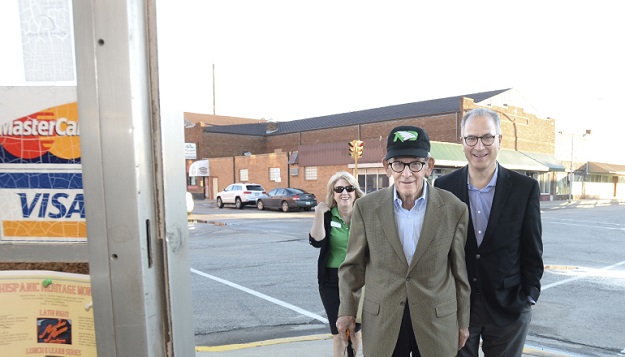 President Mark Kennedy (right), with his father Eugene Kennedy, (center) 90-years-old, and First Lady Debbie Kennedy (left) enter Paula's Cafe in Mayville.