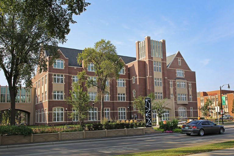 View of Nistler Hall exterior on sunny day from University Avenue