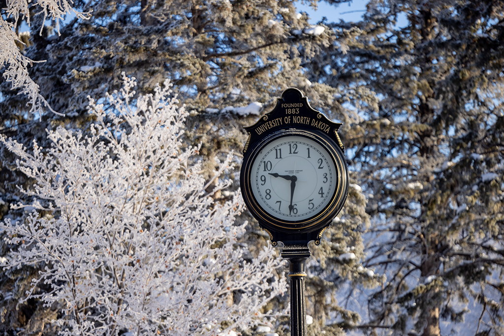 Clock in front of Twamely Hall, winter