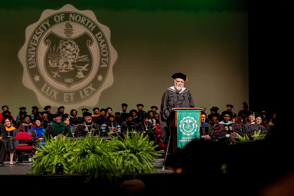 Chuck Haga speaking at commencement